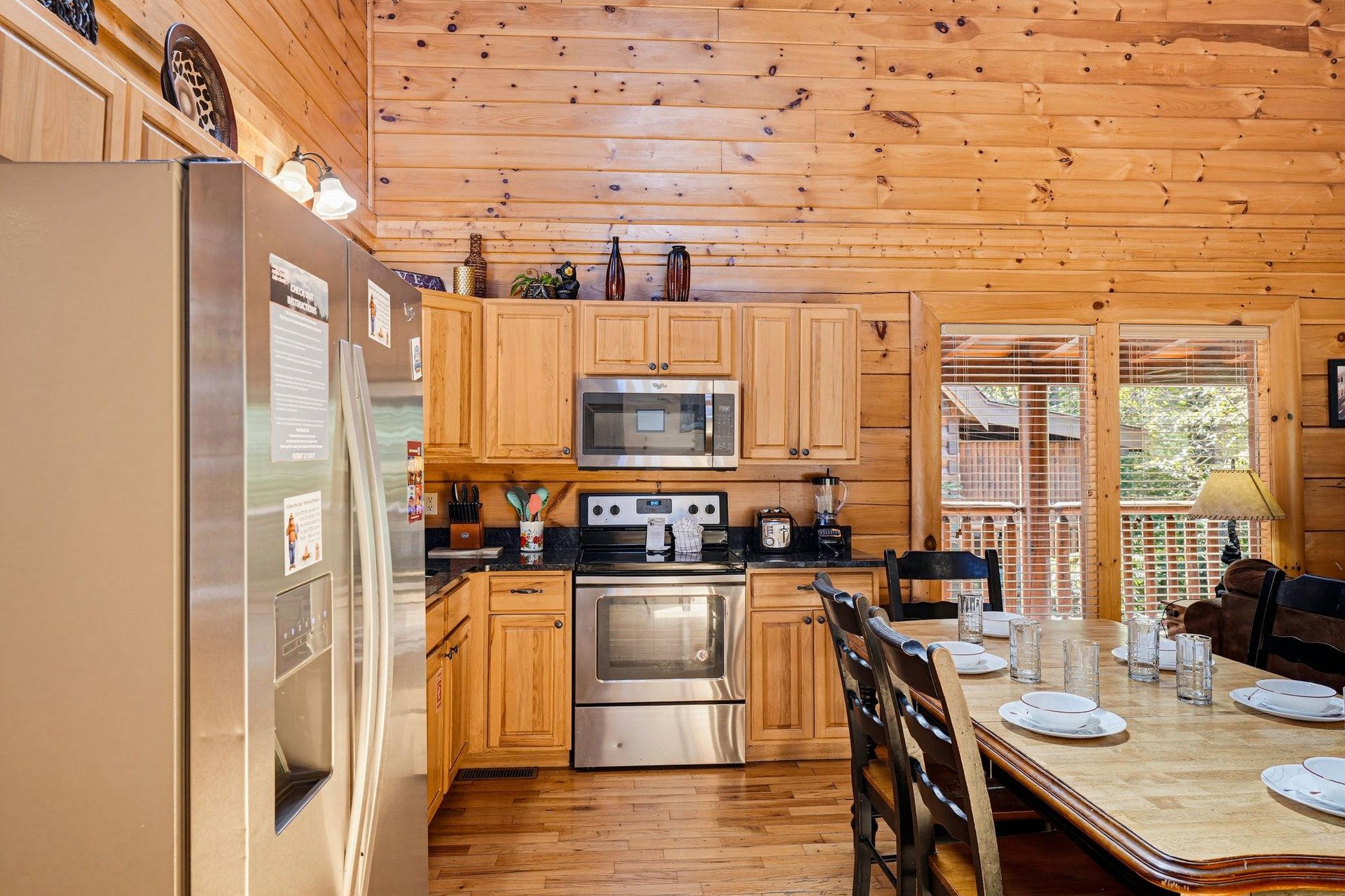 Your fullyequipped kitchen invites relaxed mornings brewing coffee and preparing meals in cozy, woodlined comfort. Step through the doors to your private deck.