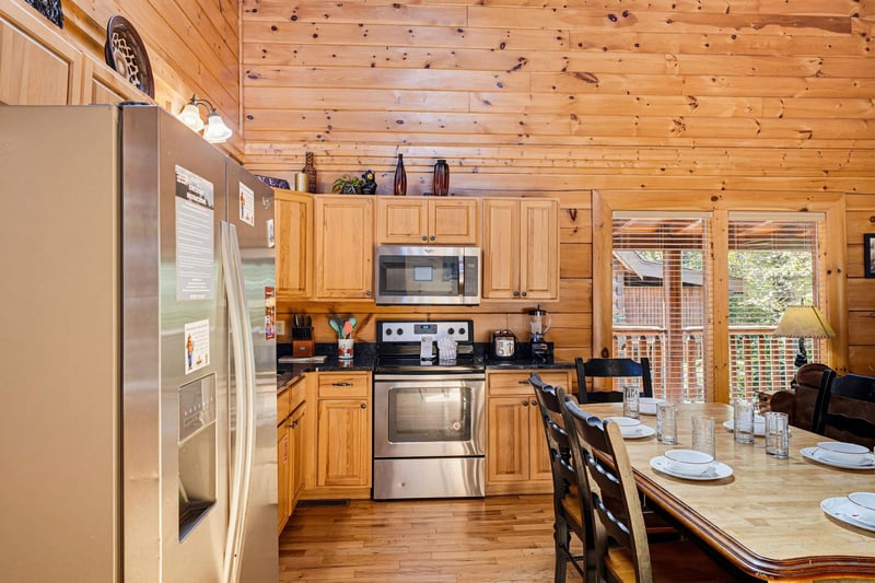 Your fullyequipped kitchen invites relaxed mornings brewing coffee and preparing meals in cozy, woodlined comfort. Step through the doors to your private deck.