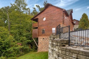 Yard and cabin exterior at Family Ties Lodge, a 4bedroom cabin rental located in Pigeon Forge
