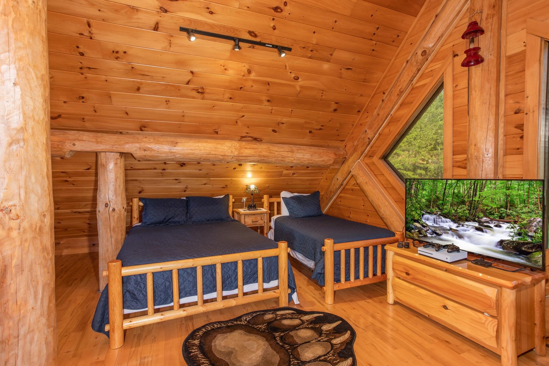 Room with three queen beds and two twin beds at Great View Lodge, a 5bedroom cabin rental located in Pigeon Forge