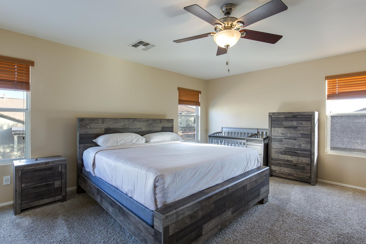 King size bed, crib, flatscreen TV, and ensuite bathroom.