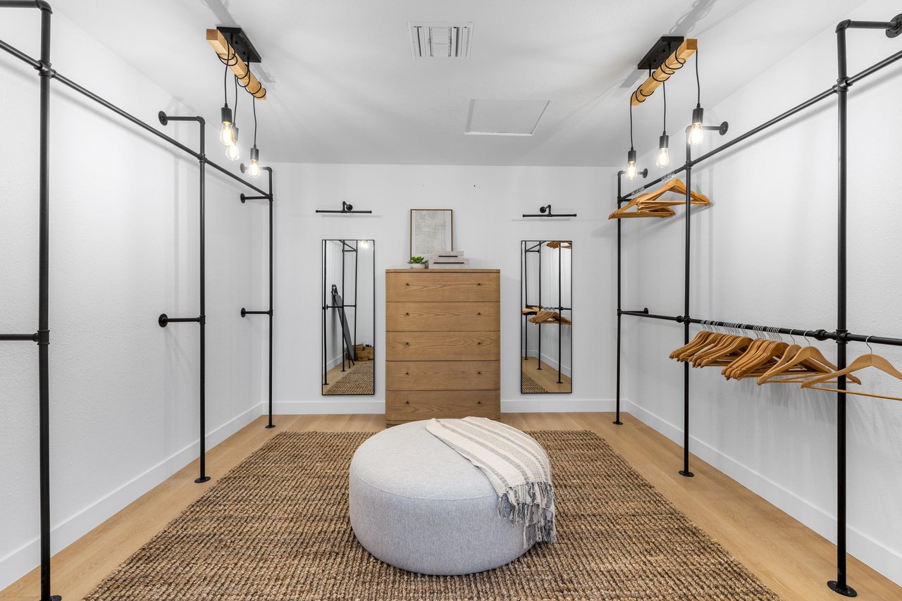 Gigantic walkin primary closet  do you have enough clothes to fit in here