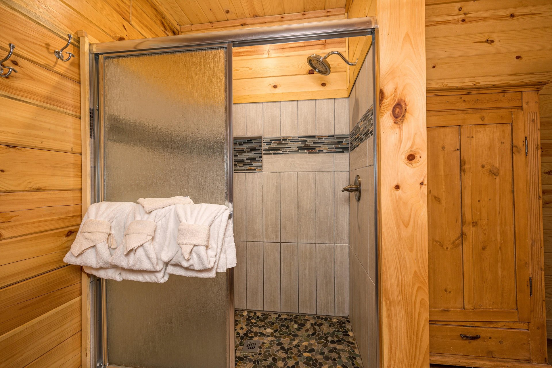 Walk in shower with tile walls