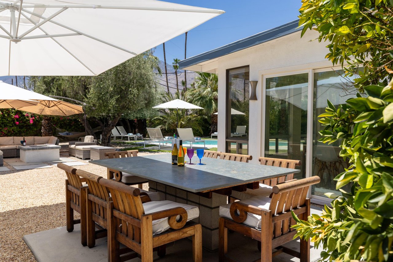Outdoor dining table and chairs for up to 8 guests just off of the indoor dining area and kitchen. Umbrella available to keep the table shaded.