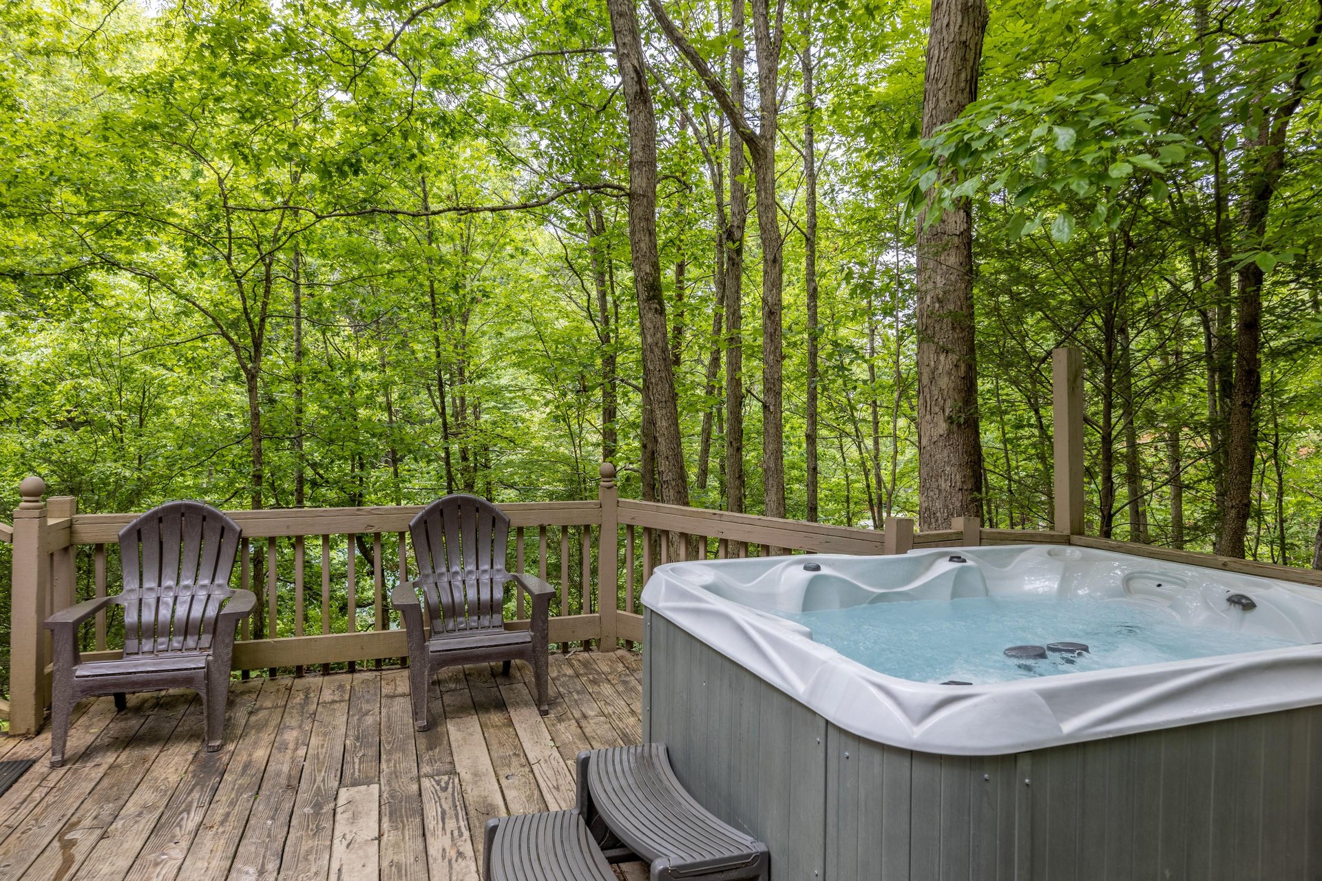 Hot tub on the deck at Heavenly Hideaway, a 2bedroom cabin rental located in Gatlinburg