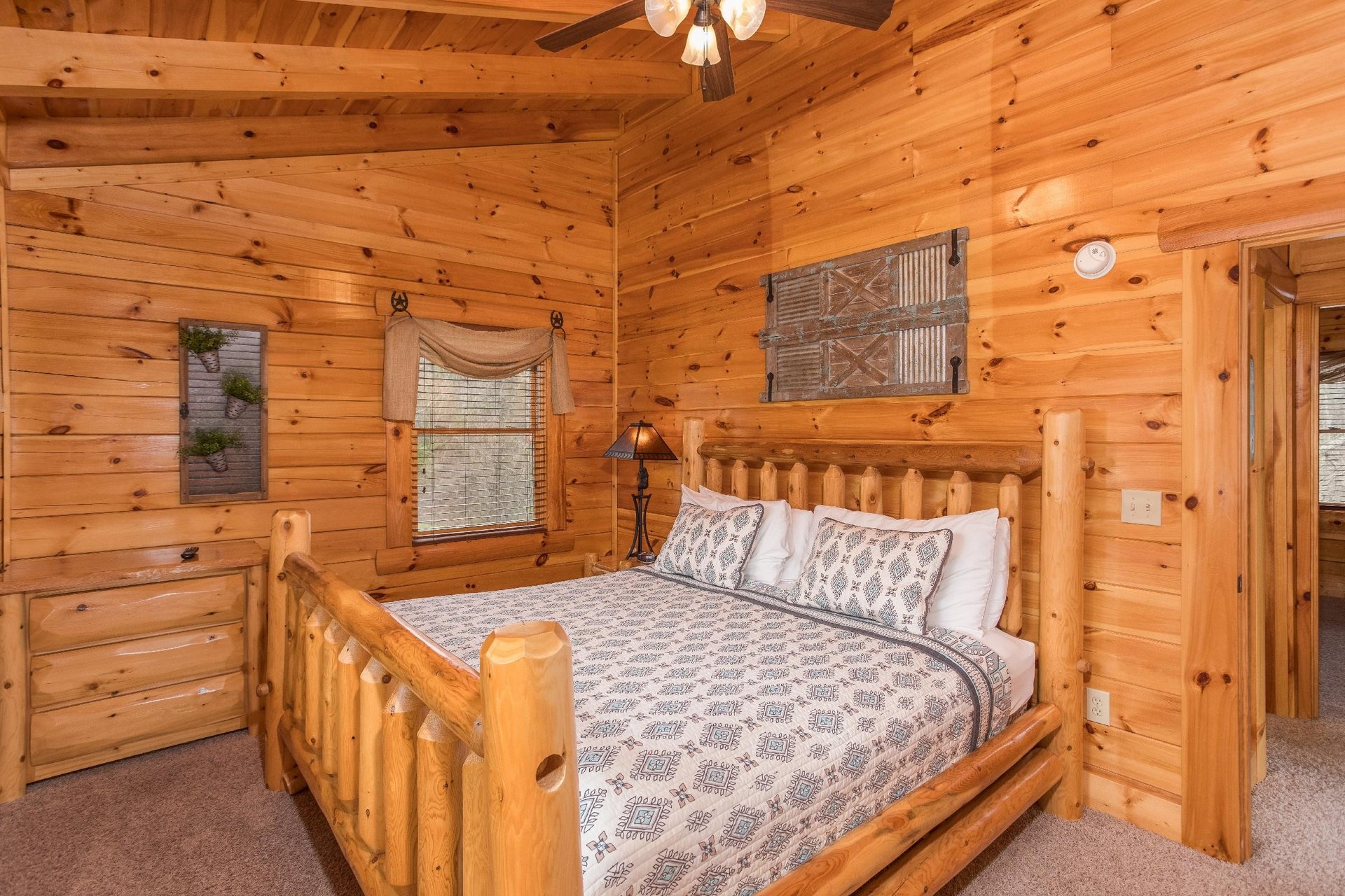 king log bed with TV and a dresser