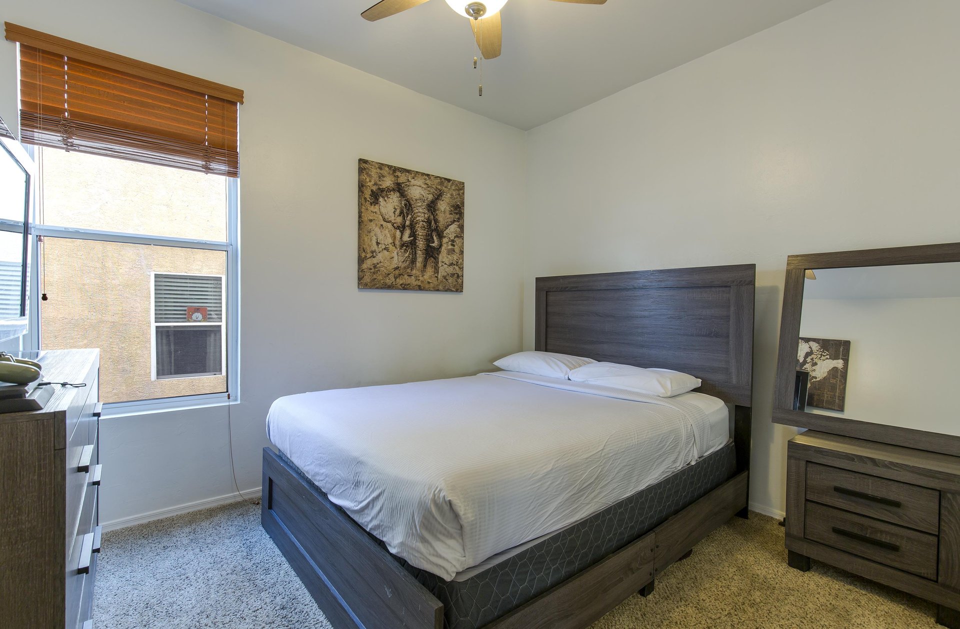 Full size bed, flatscreen TV, and plenty of clothing storage.
