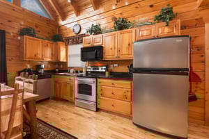 Kitchen with stainless appliances at Country Bears Getaway, a 3bedroom cabin rental located in Gatlinburg