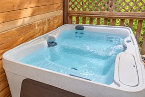 Slip into your private hot tub on the deck and let the warm bubbles melt away any tension. Surrounded by lush greenery, its your perfect spot to unwind in peace.