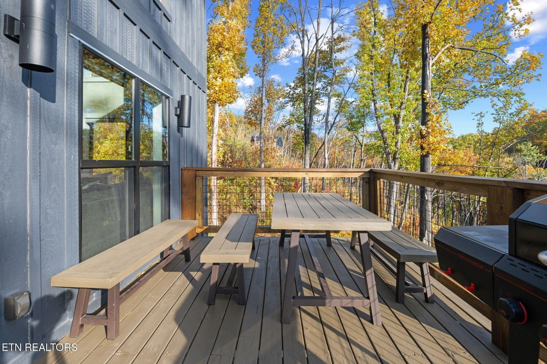 Step onto your private deck and take in stunning views of autumn foliage. The picnicstyle table and grill make it easy to enjoy meals outdoors surrounded by natures vibrant fall colors.