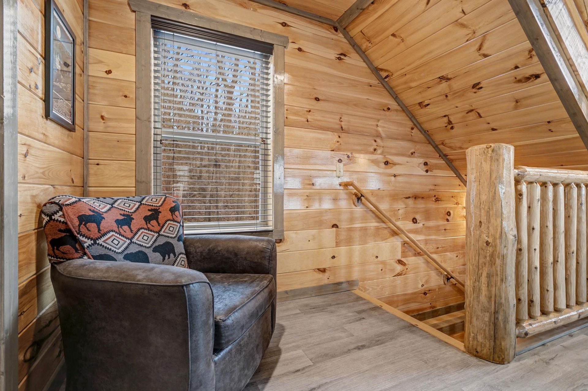 Cozy up in this charming nook with warm wood walls and rustic charm—your perfect spot for morning coffee or evening reading.