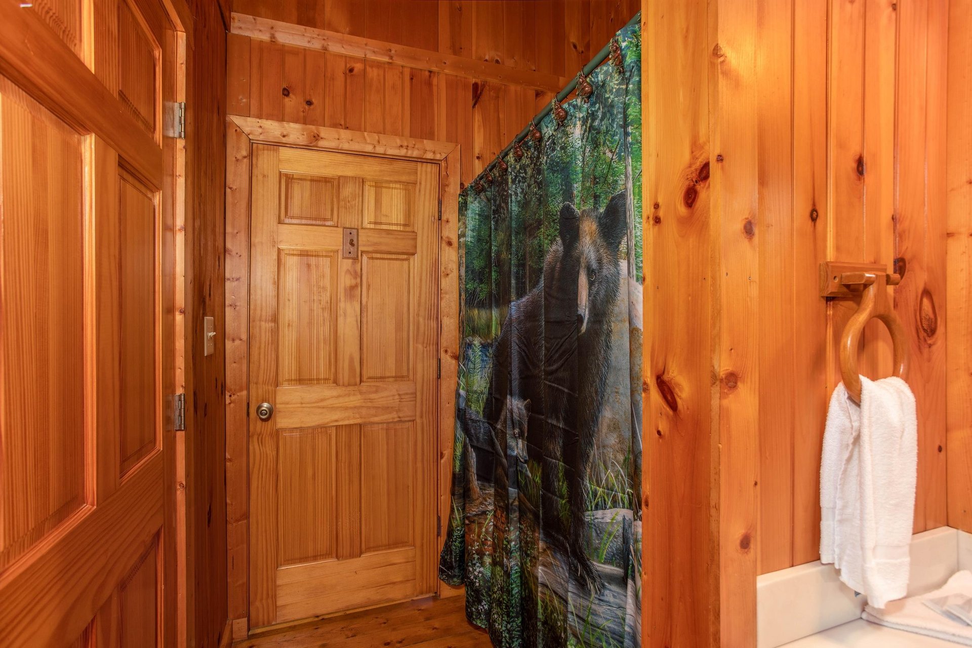 Shower with divider wall and vanity sink