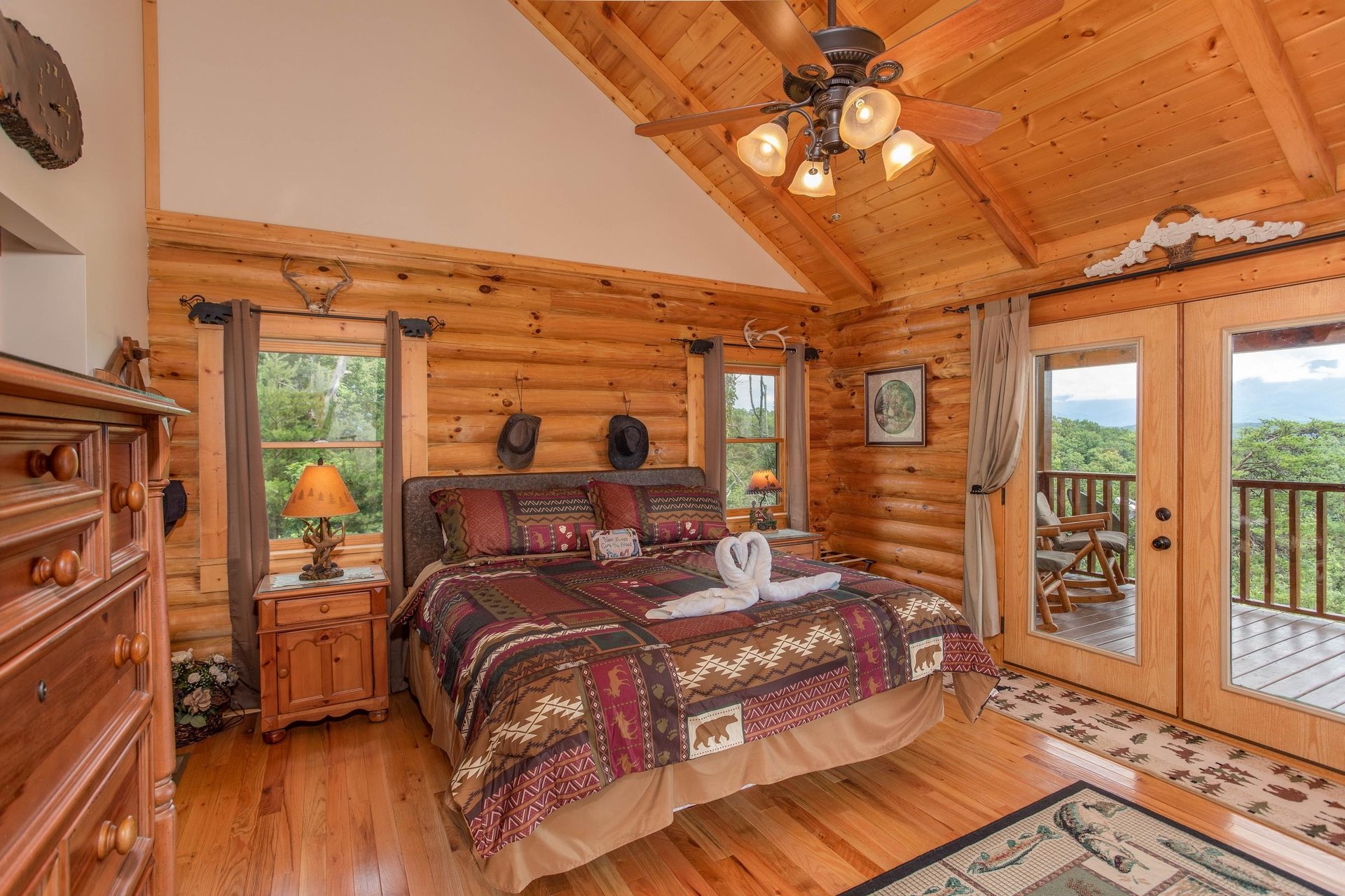 King bed with windows and doors to deck