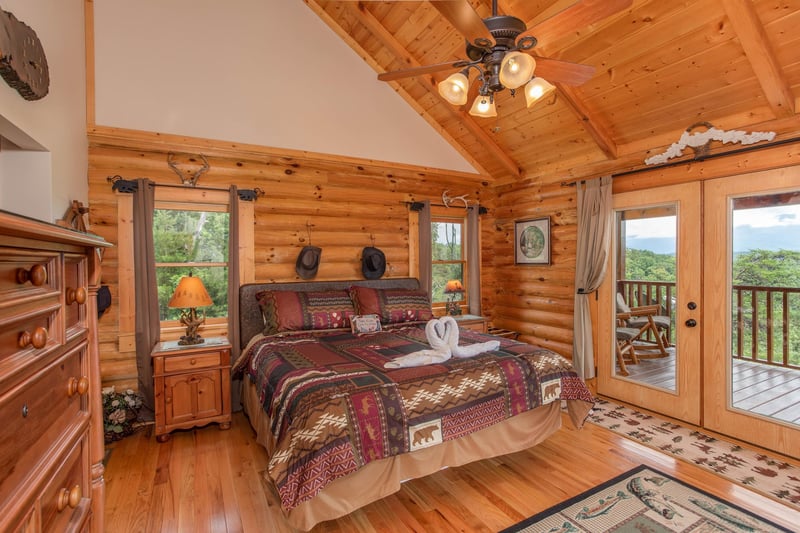 King bed with windows and doors to deck