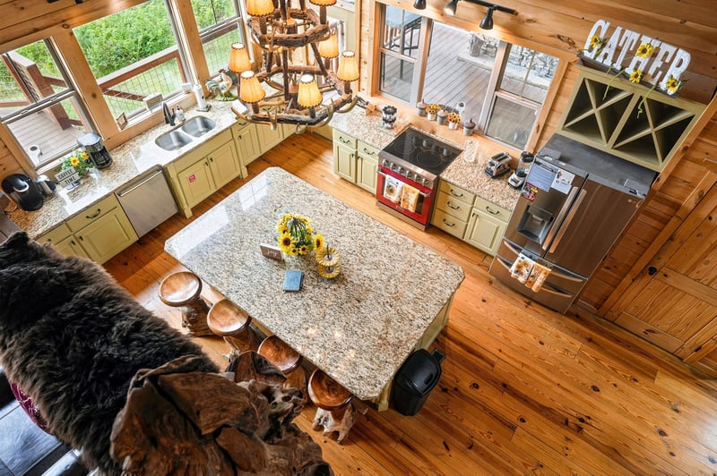 Your gourmet kitchen awaits, with polished granite countertops, professionalgrade stove, and a spacious island perfect for preparing feasts. Warm wood floors and rustic charm create a welcoming heart