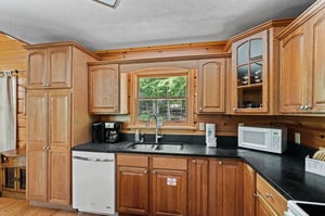 Kitchen sink with wooden cabinets
