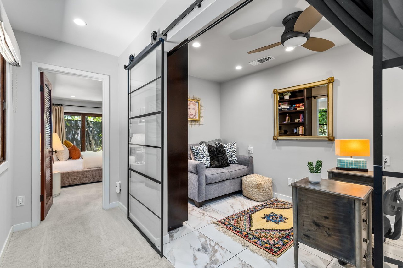 Office with desk and pullout twin sofa bed.