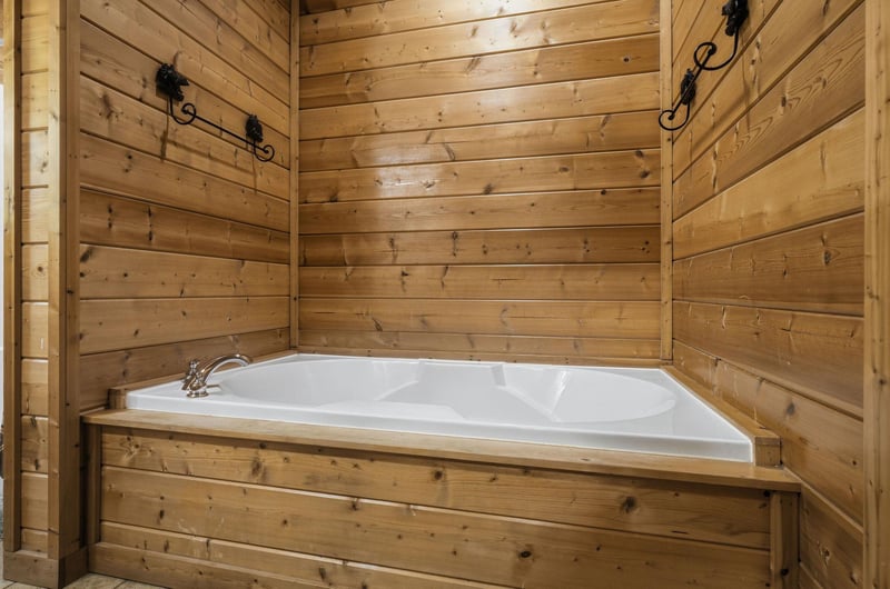 Soak away your worries in this rustic wooden bathtub sanctuary, where warm timber walls create your perfect mountain retreat escape.