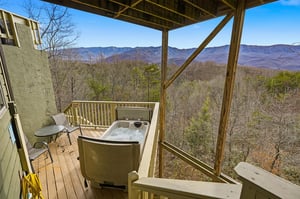 Soak in your private hot tub while gazing at breathtaking mountain vistas stretching endlessly before you.