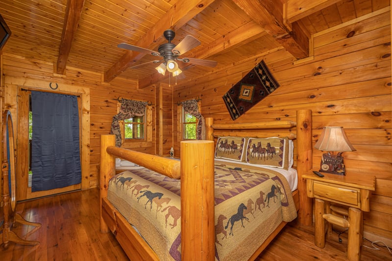 King bedroom with log furniture at Dukes Den