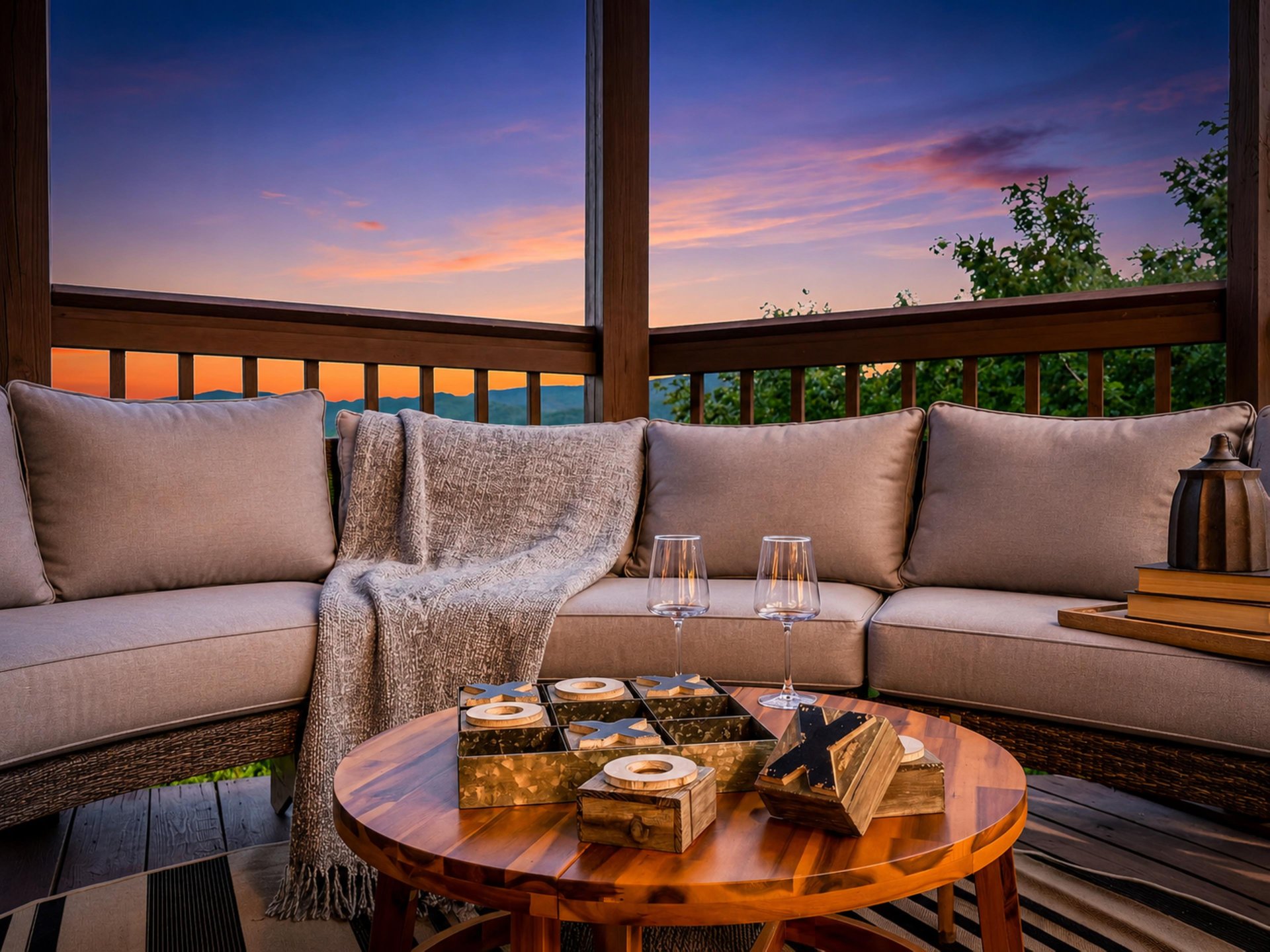 Sunset paints the sky in soft pastels as you relax on your private balcony, wine in hand, surrounded by plush seating and serene mountain views.