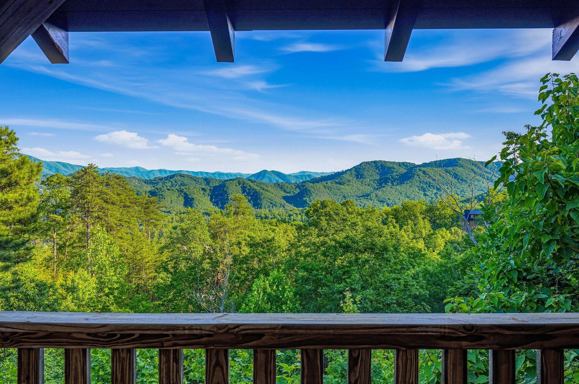 Step out onto your private balcony and soak in the breathtaking mountain vistas stretching endlessly before you. Lush green forests meet rolling peaks under a brilliant blue sky—your peaceful mountain