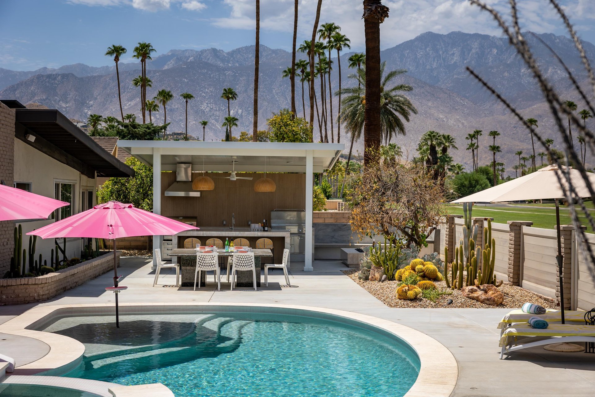 View of the outdoor kitchen and firepit.