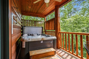 Soak in your private hot tub on your covered deck, surrounded by lush forest greenery. Let the warm jets melt your cares away in this peaceful treetop retreat.