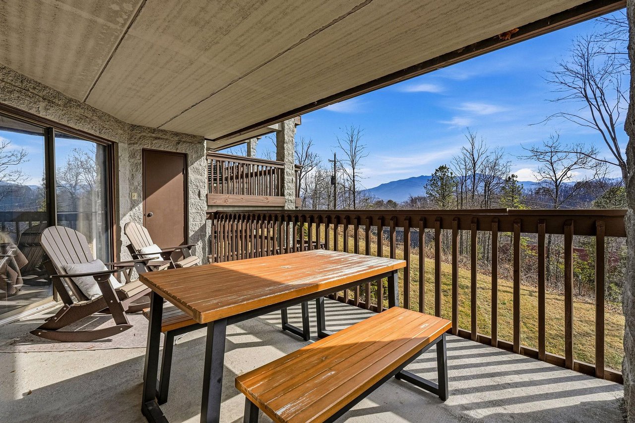 Savor your morning coffee at the outdoor dining table while soaking in stunning mountain views from your private balcony.