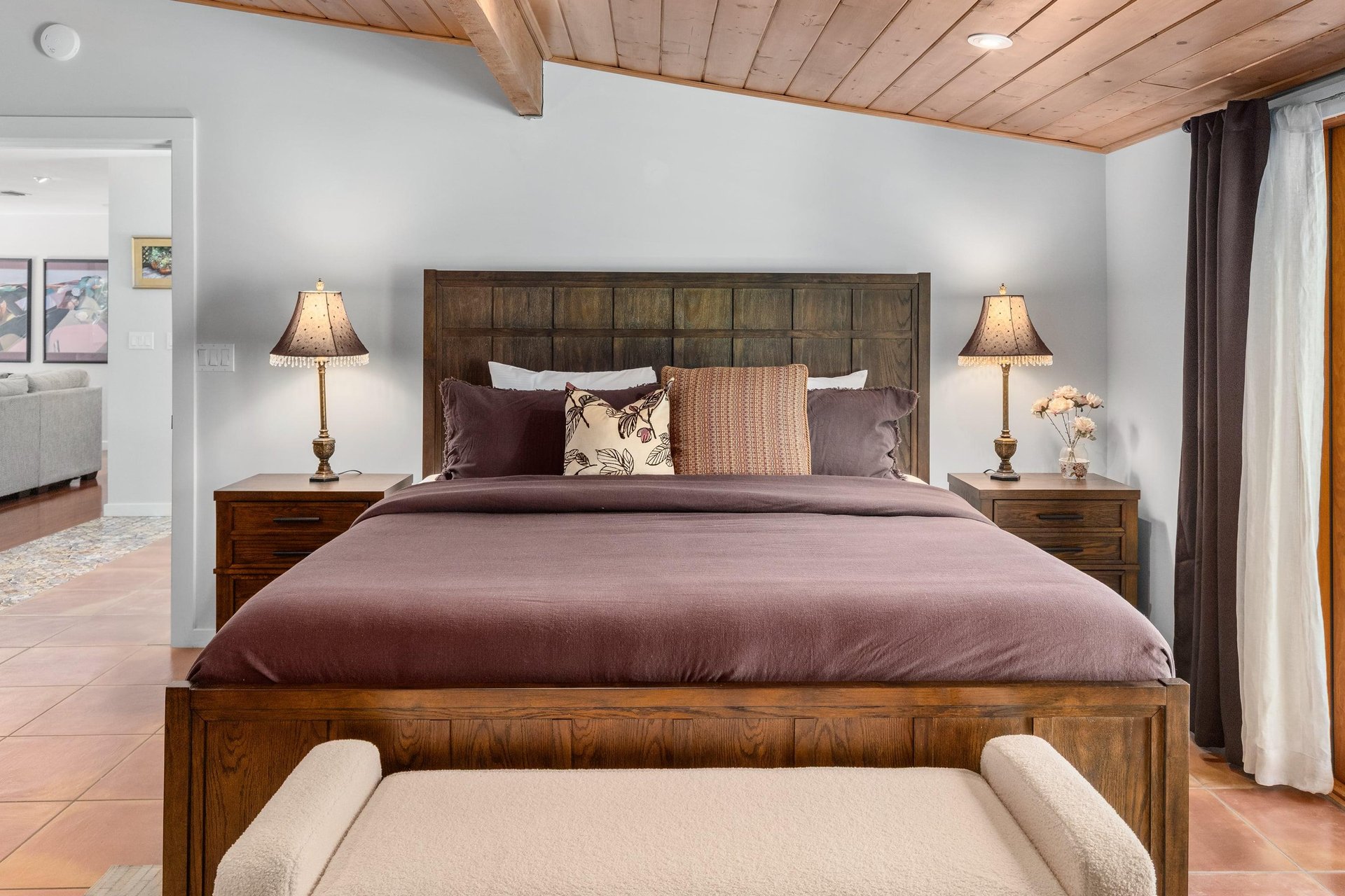 King bed, smart TV, patio access, and ensuite bathroom.
