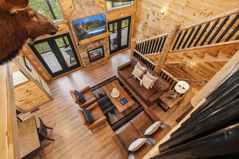 Sink into rich leather seating in this soaring great room where rustic charm meets mountain luxury.
