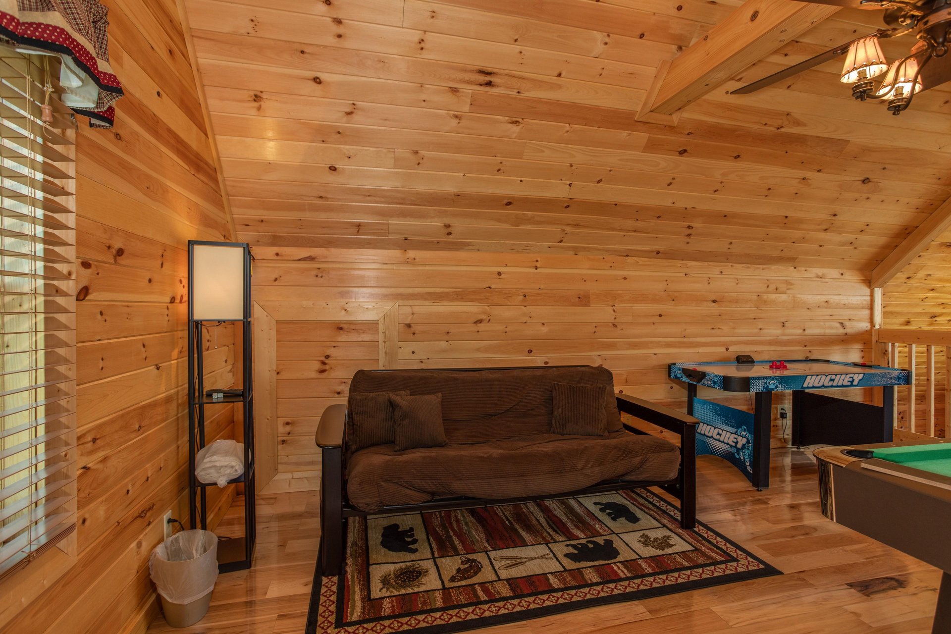 Futon in the loft at Momma Bear, a 2 bedroom cabin rental located in Pigeon Forge
