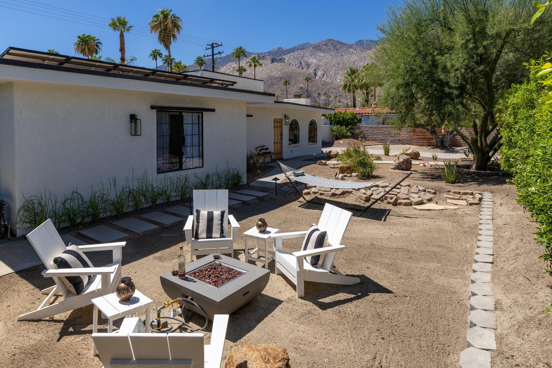 Side yard with firepit and hammock