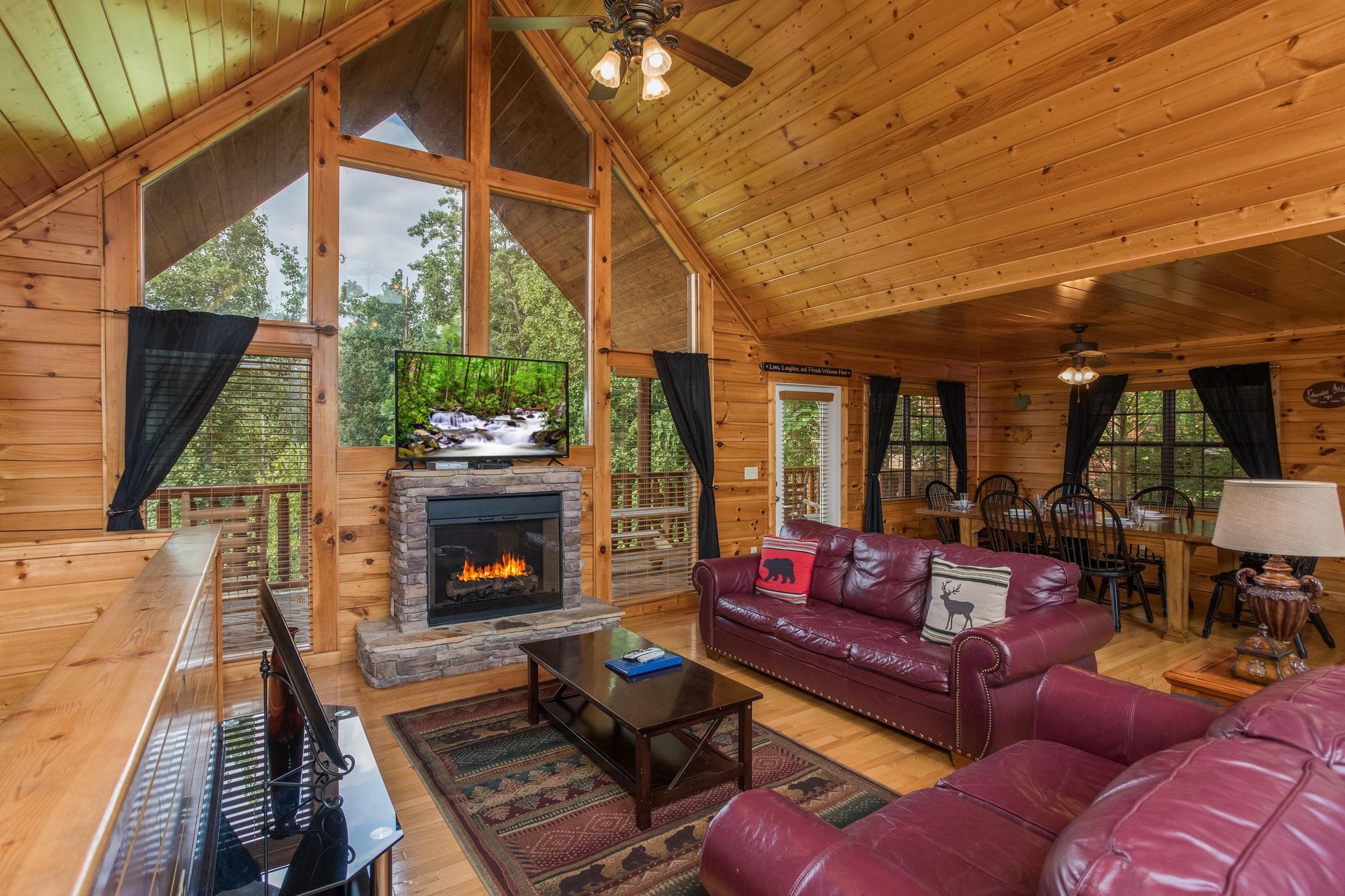 Living room with a fireplace and TV Kick Back  Relax A 4 bedroom cabin rental located in Pigeon Forge
