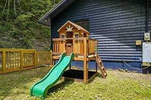 Little ones will love their own adventure headquarters—a charming playhouse complete with a slide, ladder, and sunny deck to let imaginations soar.