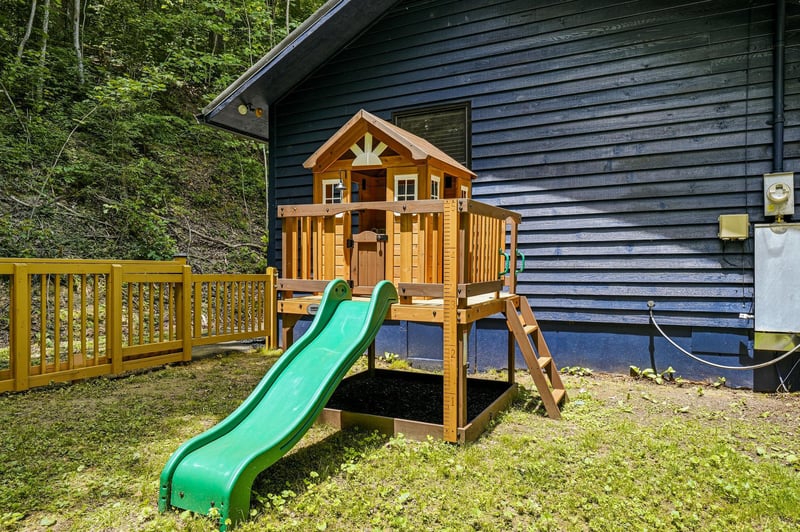 Little ones will love their own adventure headquarters—a charming playhouse complete with a slide, ladder, and sunny deck to let imaginations soar.