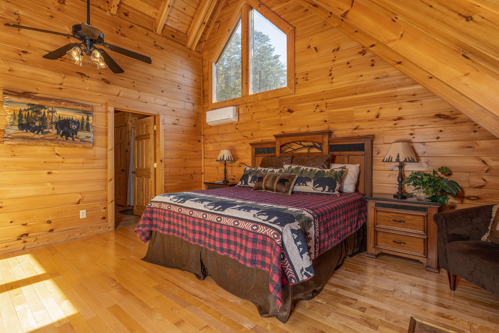 Bedroom with king bed, two night stands, and lamps at Bears Dont Bluff, a 3 bedroom cabin rental located in Pigeon Forge