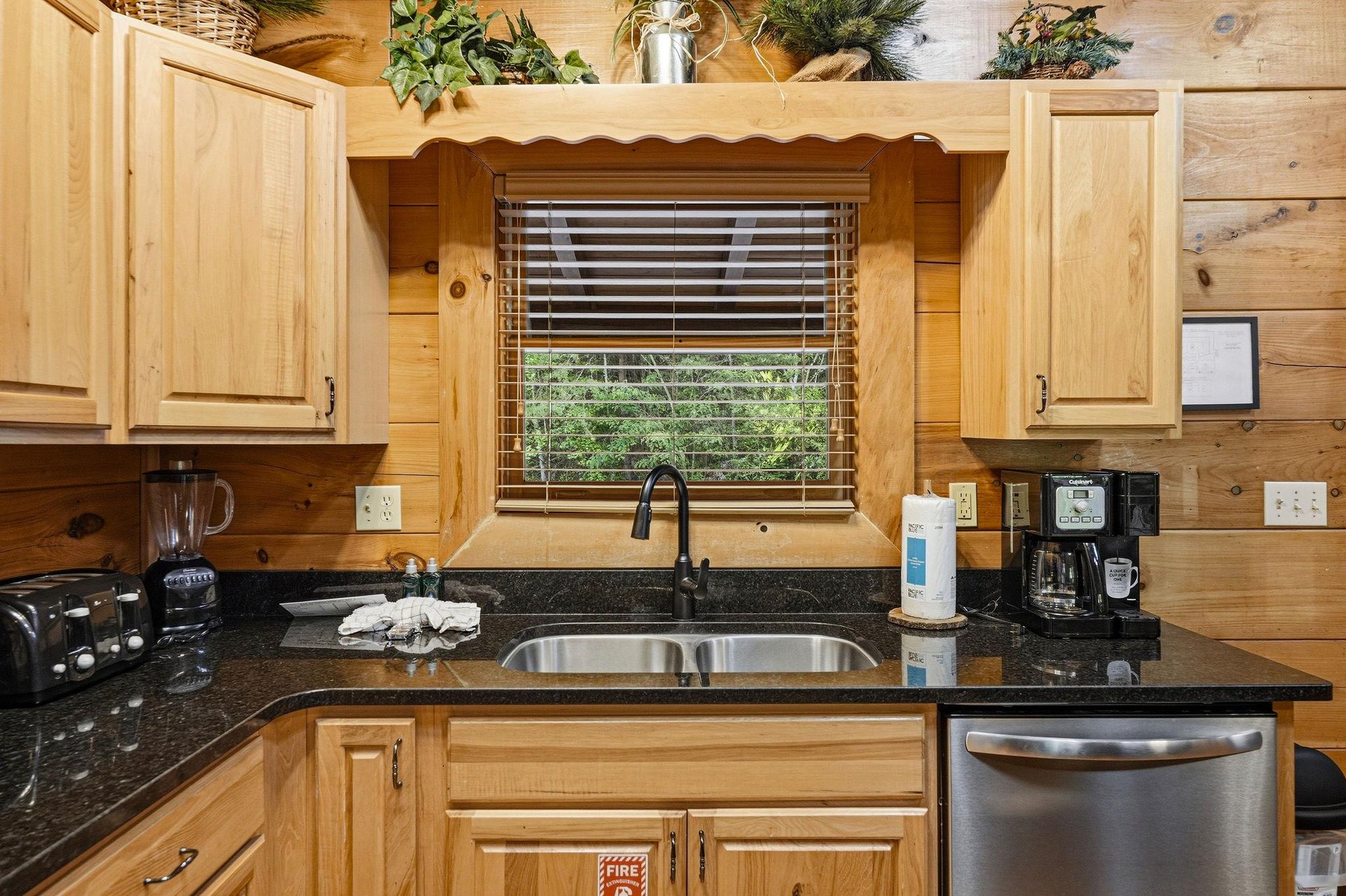 Prepare your morning coffee in this fullyequipped kitchen with granite counters, stainless appliances, and a garden view window.