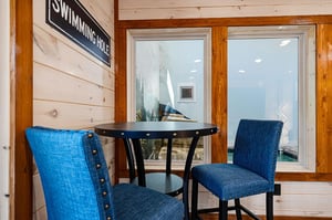Cozy seating area near the swimming pool—perfect for relaxing with your morning coffee or planning your next dip.