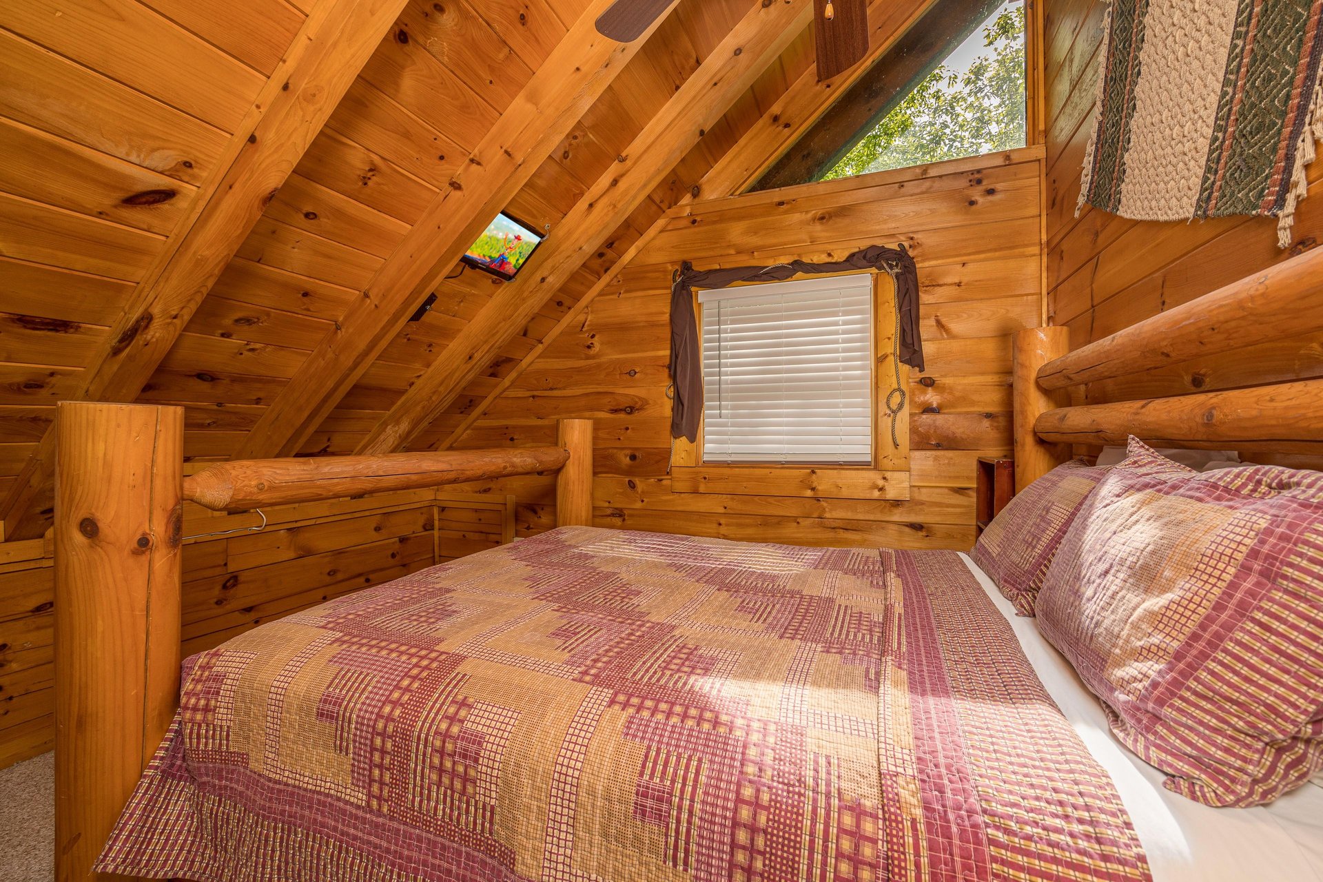 Queen bed with sloped wall