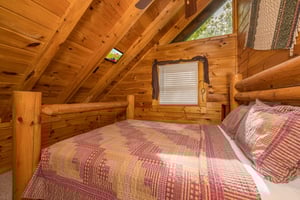 Queen bed with sloped wall