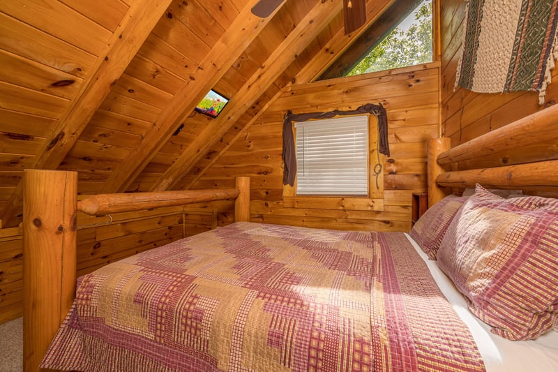 Queen bed with sloped wall