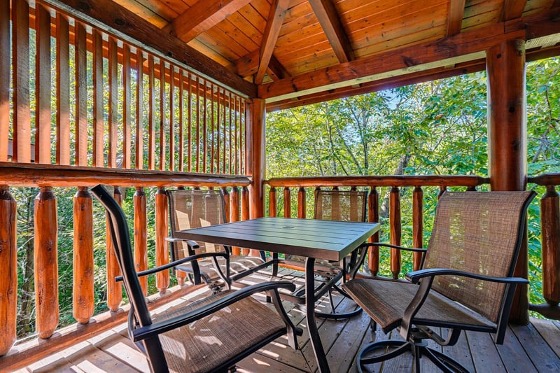 Step onto your private covered balcony and settle into your own peaceful retreat. Surrounded by lush greenery and warm wood details, this cozy spot invites you to sip morning coffee or unwind with eve