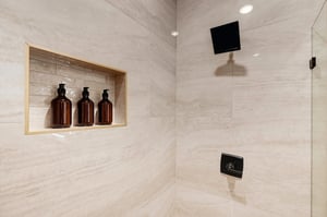 Slip into your private rainfall shower with spaquality amenities awaiting you in the builtin niche—luxurious touches that make every rinse feel like a retreat.
