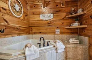 Slip into your own spalike soaking tub framed by warm wood and natural stone. Fluffy towels and thoughtful touches create a peaceful retreat where you can truly unwind.