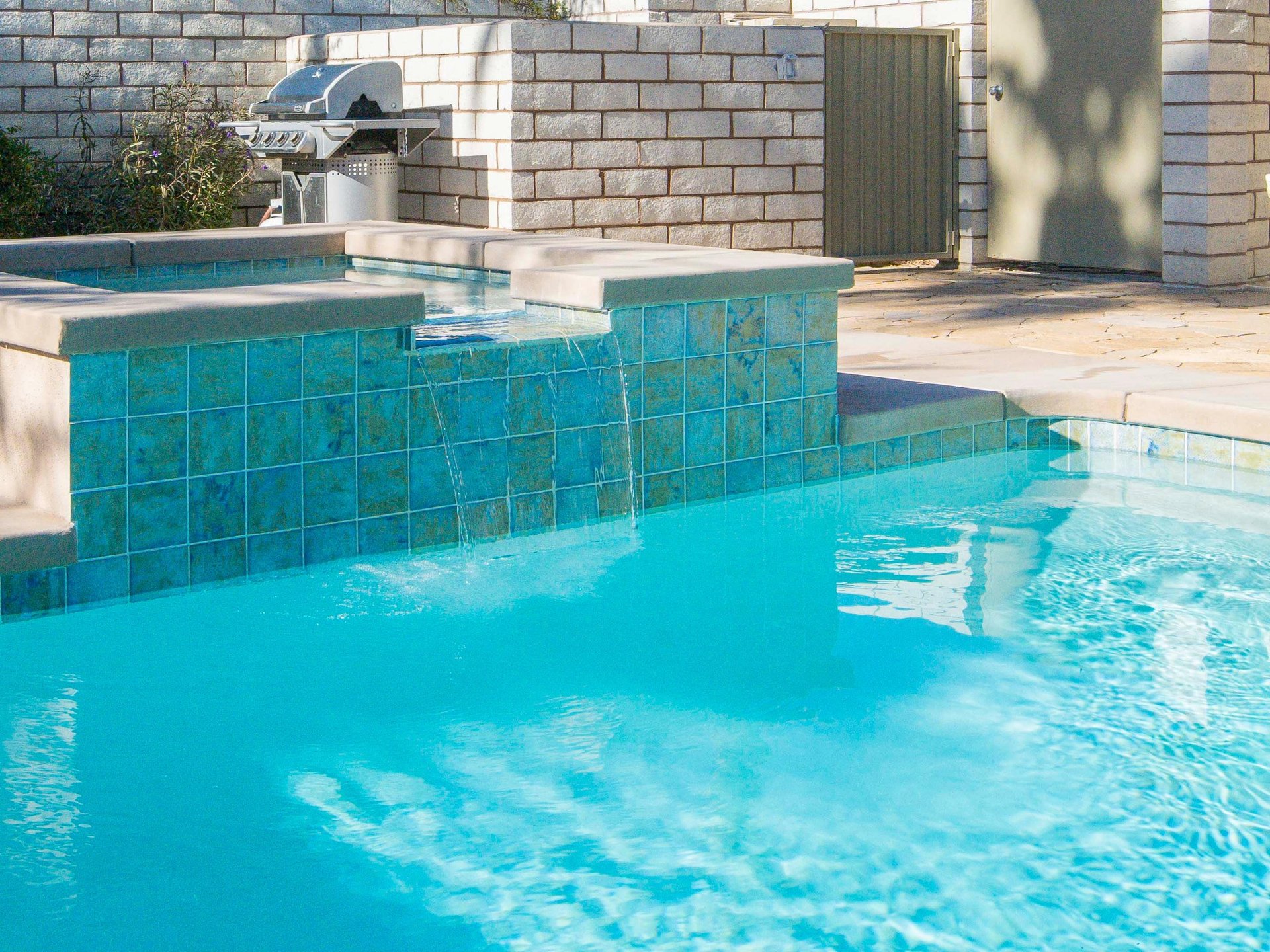 Integrated waterfall spa