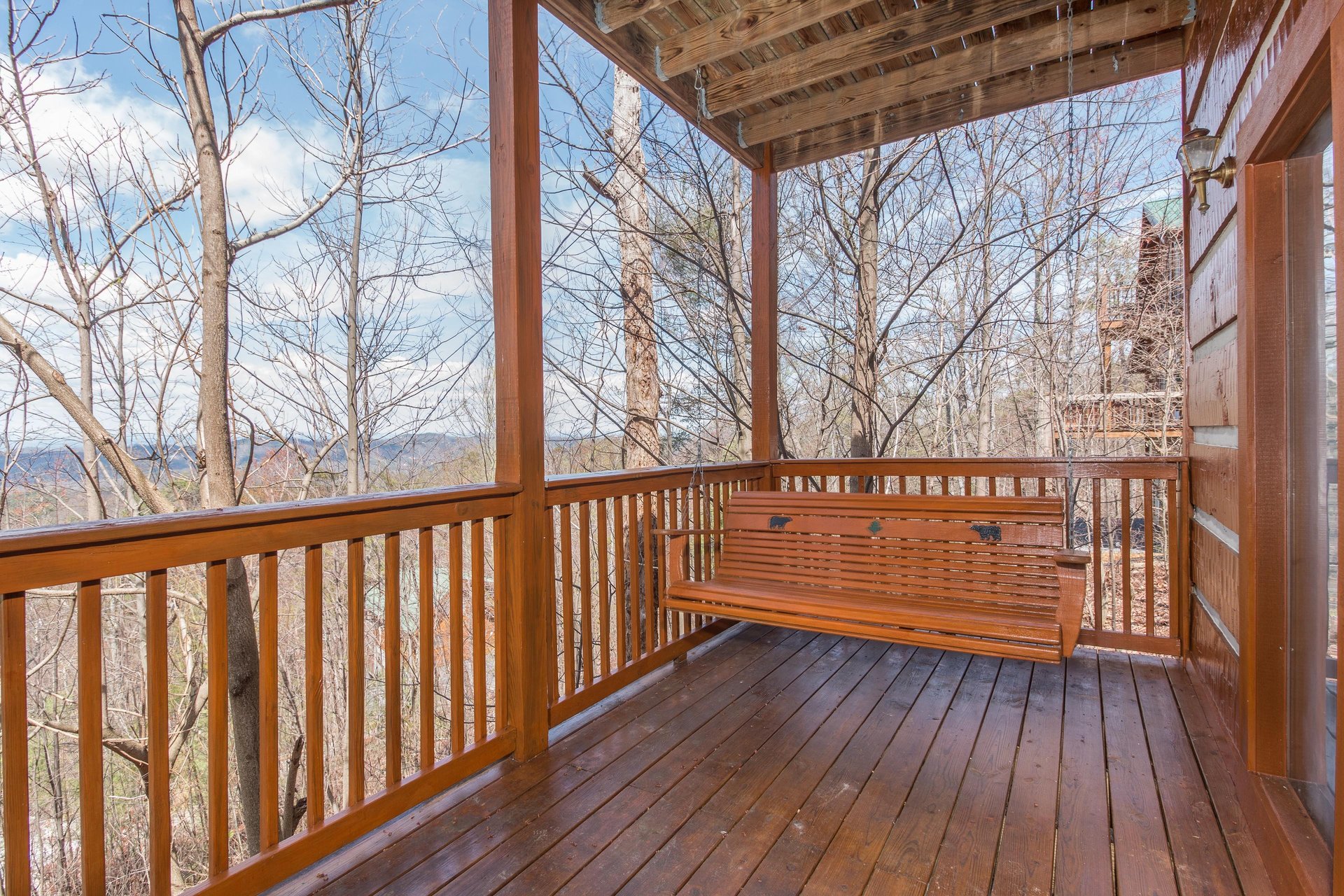 Swing on the lower deck at EllaVation, a 3 bedroom cabin rental located in Gatlinburg
