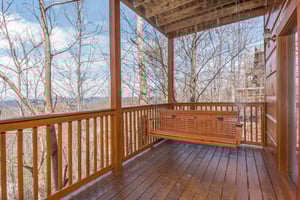Swing on the lower deck at EllaVation, a 3 bedroom cabin rental located in Gatlinburg