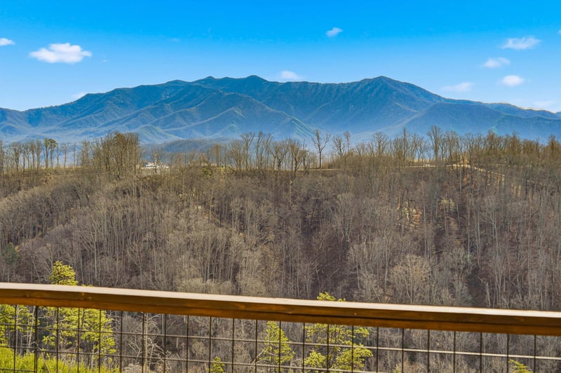 Sweeping mountain views from this elevated terrace showcase the natural beauty surrounding the property.