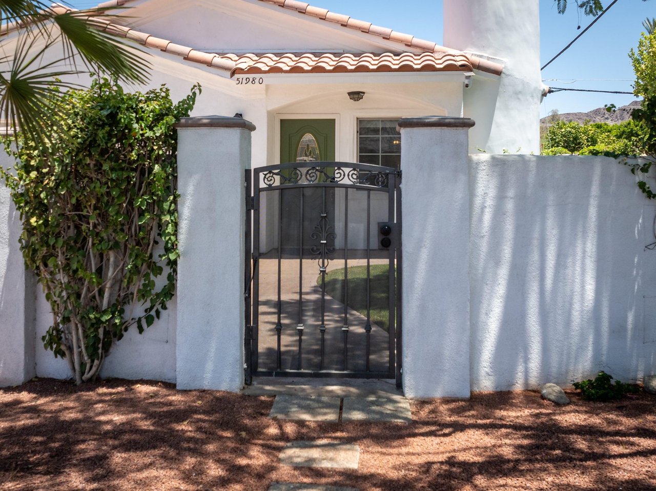Gate near the front of the home for added privacy.